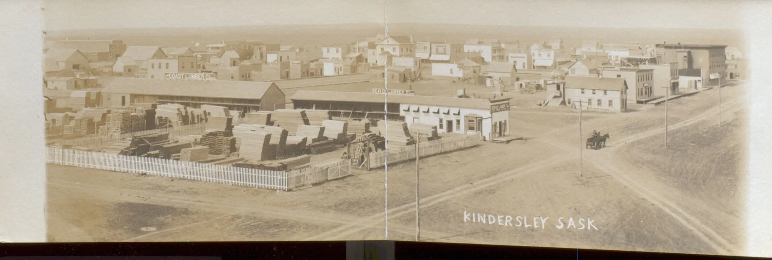 Panoramic view of Kindersley with lumberyard and town streets