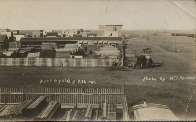 Kindersley town site with lumber yard and tractor, April 1910